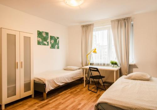 Duże Mieszkanie - Kniaziewicza dla 2-10 osób tesisinde bir odada yatak veya yataklar