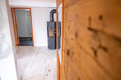 a door leading into a room with a bathroom at Appartement Binna in Termen