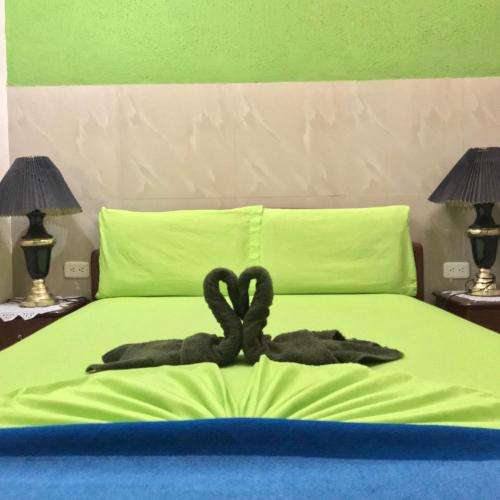 Postel nebo postele na pokoji v ubytování Hostal Puerto Azul