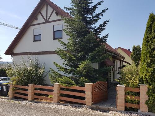 a house with a wooden fence in front of it at Kunst und Kultur in Weimar in Weimar