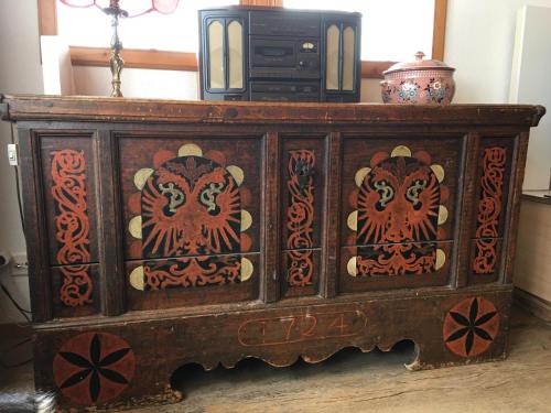 a wooden cabinet with two tigers painted on it at Endweg in Grindelwald