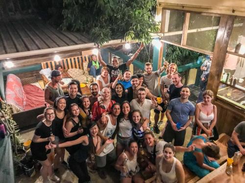 a group of people posing for a picture at Bella's Backpackers Cayo in San Ignacio
