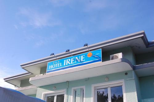 a hotel entrance sign on top of a building at Hotel Irene in Lignano Sabbiadoro