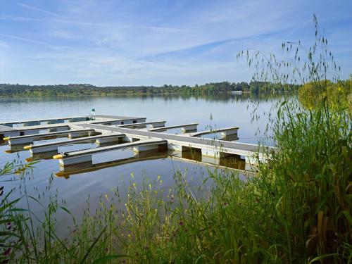 a group of boats sitting on a lake at Montargil Monte Novo in Montargil