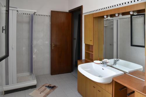 a bathroom with a sink and a shower at Villa Mary in Torre Lapillo