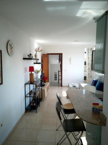 a kitchen and living room with a table and chairs at UNION 64 in Vecindario