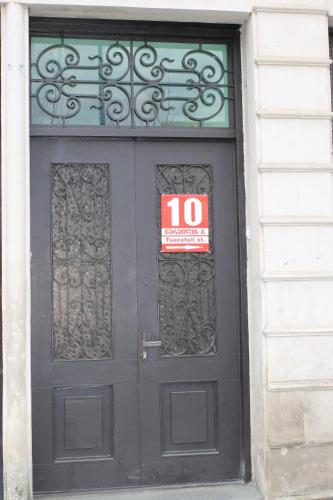 a black door with a no entry sign on it at ALINA'S ROOM in Kutaisi