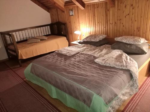 a bedroom with two beds in a room at Apartment Proljeće in Fužine