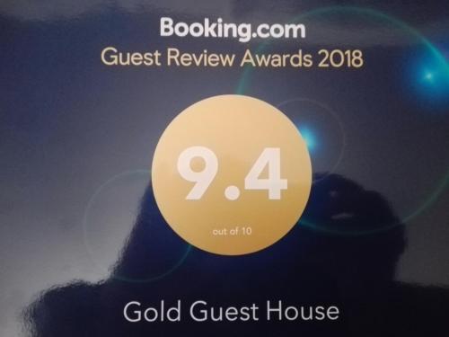 a poster for the gold guest house at the forest review awards at Gold Guest House in Gonio