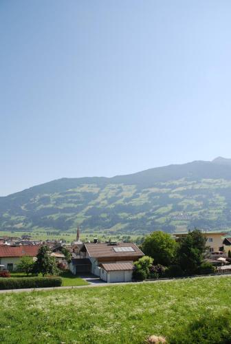 a view of a town with a hill in the background at Sportpension Christina by PiaundDirk in Fügen