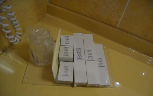 a pile of boxes sitting on top of a table at Hotel Motel 2 in Castel San Giovanni