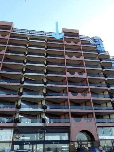 a tall building with a shark painted on it at Large beachstudio seaview Blankenberge near Brugge in Blankenberge