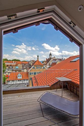 a balcony with a view of a city at Boutique - Hotel Adara in Lindau