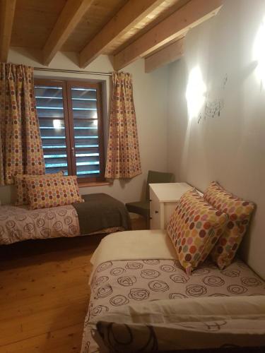 a small bedroom with a bed and a window at Gite De La Tannerie 2 in Dinan