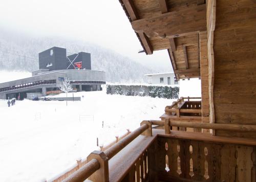 a view of a building in the snow at Alpenchalet Brücke in Mayrhofen