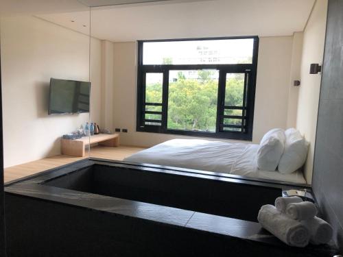 Una cama o camas en una habitación de Water House