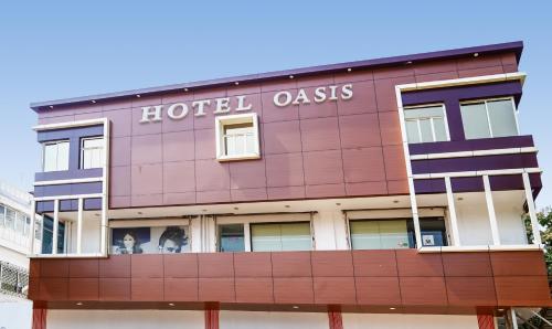 a building with the words hotel oasis on it at Treebo Trend Oasis Cuttack Puri in Bhubaneshwar