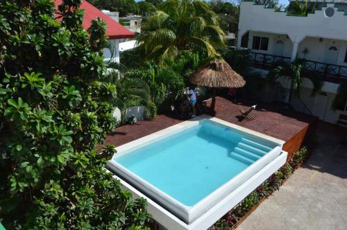 an overhead view of a swimming pool next to a house at Kukulcan by Emotion in Tulum