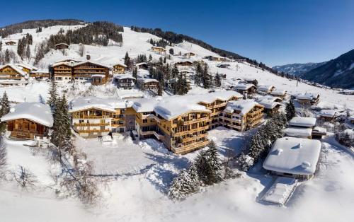 an aerial view of a resort in the snow at AlpenParks Hotel & Apartment Sonnleiten in Saalbach Hinterglemm