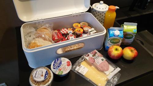 a refrigerator filled with food and other food items at Bed & Breakfast Coopz in Doetinchem