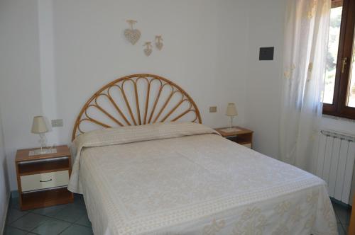 Llit o llits en una habitació de Appartamento Li Puntiti 1