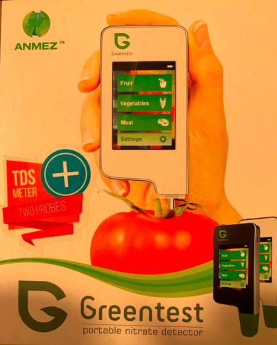 a person holding up a cell phone in front of a tomato at Hotel Silver in Hajdúszoboszló