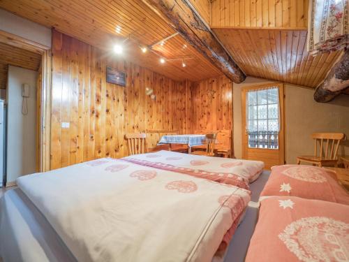 Кровать или кровати в номере Apartments & Rooms MyHolidayLivigno