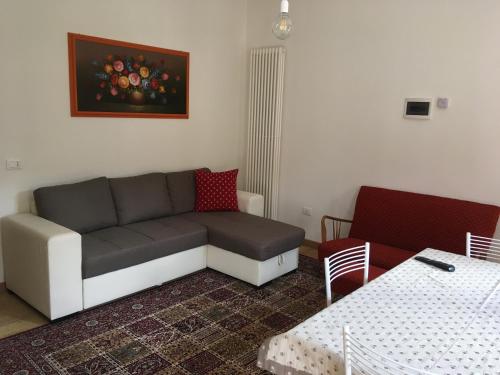 a living room with a couch and a table at Antica Casa Nella in Venas