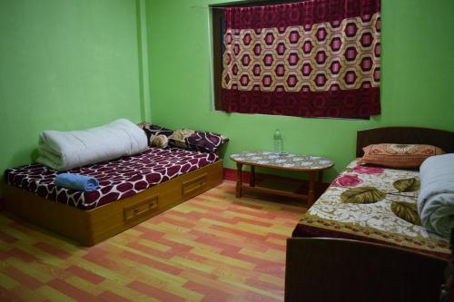 Ein Bett oder Betten in einem Zimmer der Unterkunft Nagarkot Trekkers Inn