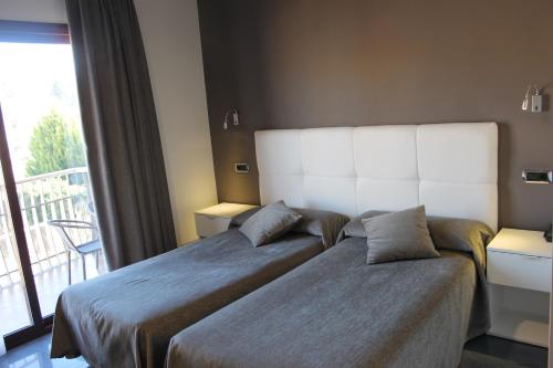 Cama o camas de una habitación en Hotel El Salt