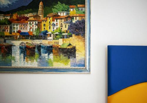 a painting of a city with boats in the water at B&B La casa D'amare in Maiori
