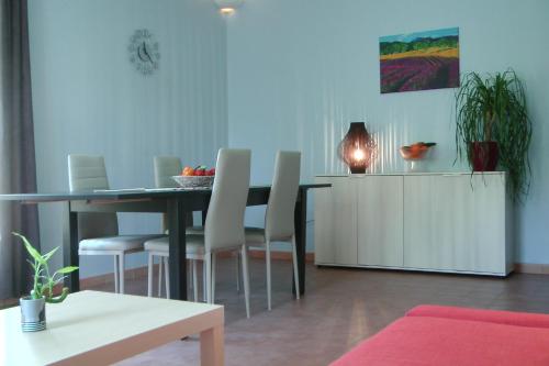 a dining room with a table and chairs at Le Moulin Des Ocres in Apt