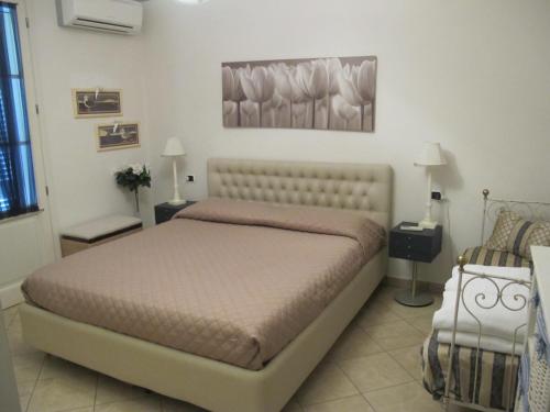 En eller flere senge i et værelse på Il Palco residence