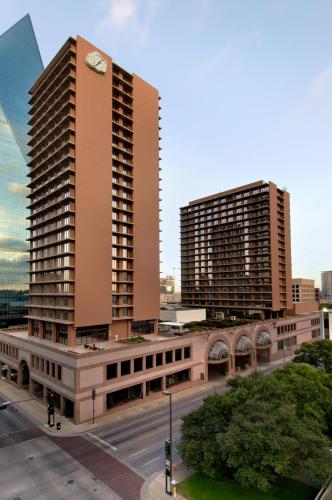 a tall building with a clock on top of it at Fairmont Dallas in Dallas