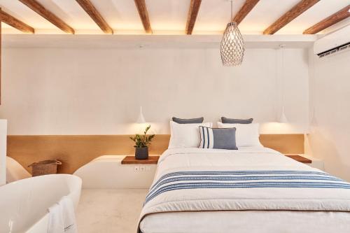 Katil atau katil-katil dalam bilik di Parian Boutique Hotel