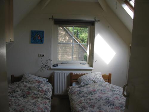 Tempat tidur dalam kamar di Klomp Sy Huis