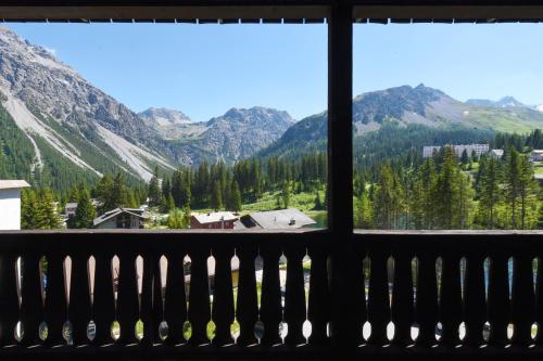 a view from the balcony of the mountains at Hotel Seehof-Arosa in Arosa