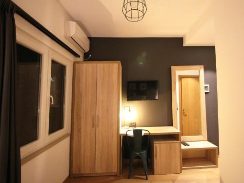 TV a/nebo společenská místnost v ubytování Oda Hotel Tirana