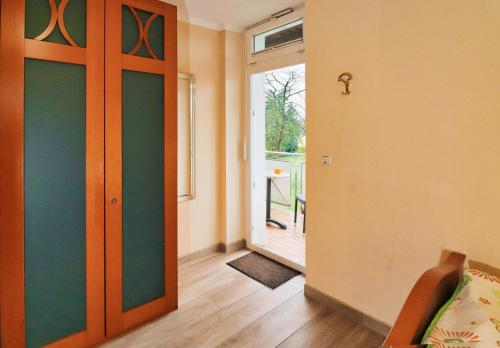 a room with a door and a room with a window at Hotel Maurer in Saarwellingen