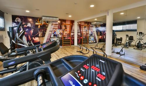 a gym with treadmills and cardio equipment in a room at ARCUS Hotel By Atlântica in Aracaju