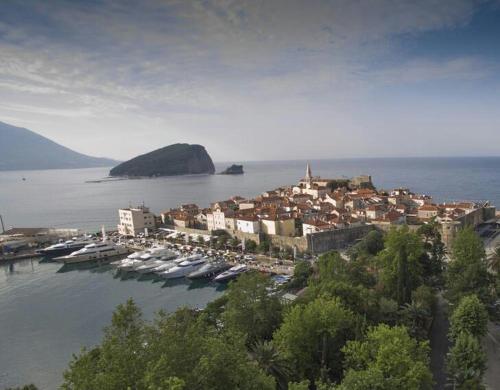 a group of boats are docked in a harbor at Old Town Skyline apartment 3 in Budva