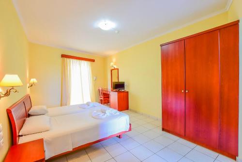 Posteľ alebo postele v izbe v ubytovaní Timos Hotel