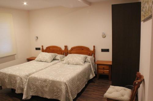 Postel nebo postele na pokoji v ubytování Hostal Extremeño