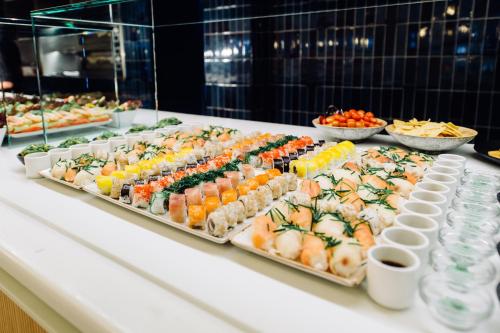a buffet with many different types of food on a table at Inturotel Cala Esmeralda Beach Hotel & Spa - Adults Only in Cala d´Or