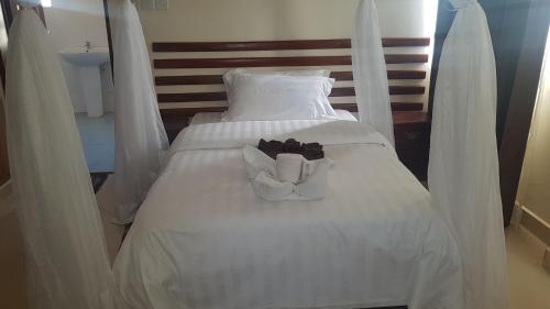 Postel nebo postele na pokoji v ubytování Calabash Hotel, Migori