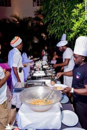 a group of chefs preparing food on a buffet table at Retreat Guest House in Falmouth