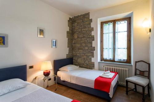 Un pat sau paturi într-o cameră la Villa Del Sole