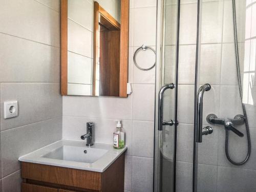 a bathroom with a sink and a shower at Canos Verdes Apartment II in Angra do Heroísmo