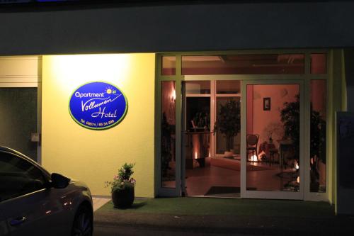 a building with a sign on the side of it at ApartmentHotel Vollumen in Redwitz an der Rodach