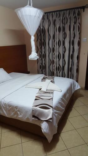 Postel nebo postele na pokoji v ubytování Calabash Hotel, Migori